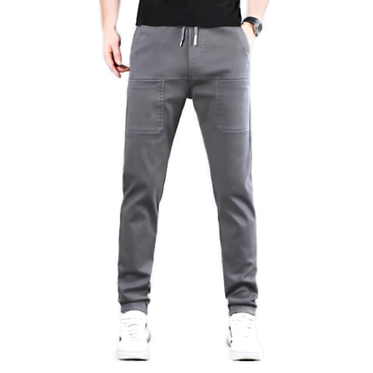 Front view of grey drawstring trousers worn by a model, showing two large patch pockets 1