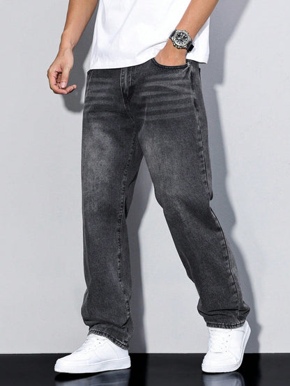 Faded black loose-fit jeans on a model, showing whiskering and grey fading across the thighs. 14