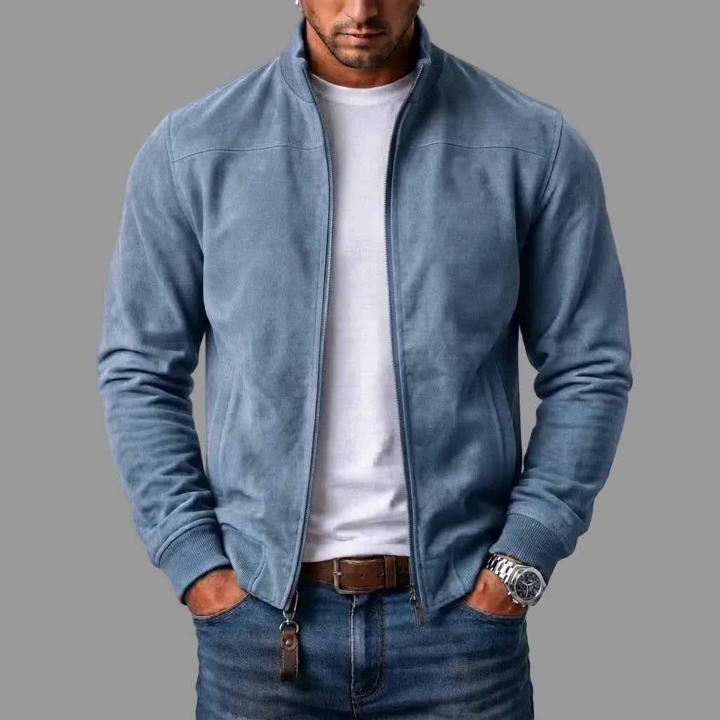 Model wears the light blue suede-look bomber jacket unzipped over a white T-shirt and jeans, with a leather tag hanging from the zip. 3