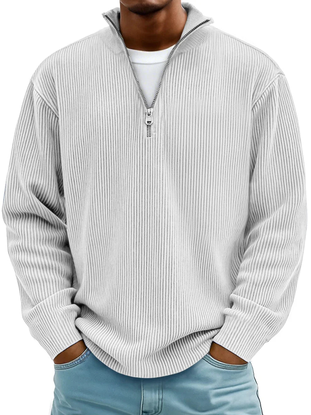 Man wearing the zip-collar ribbed sweater in off-white over a white tee, with light blue jeans 6