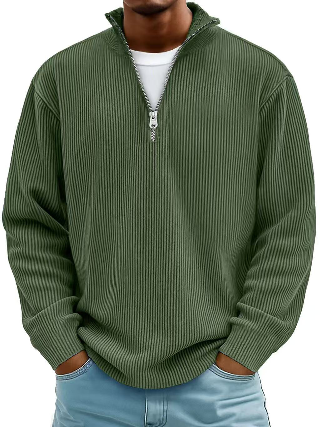 Man wearing the zip-collar ribbed sweater in dark olive green, slightly closer crop, with white tee underneath 8