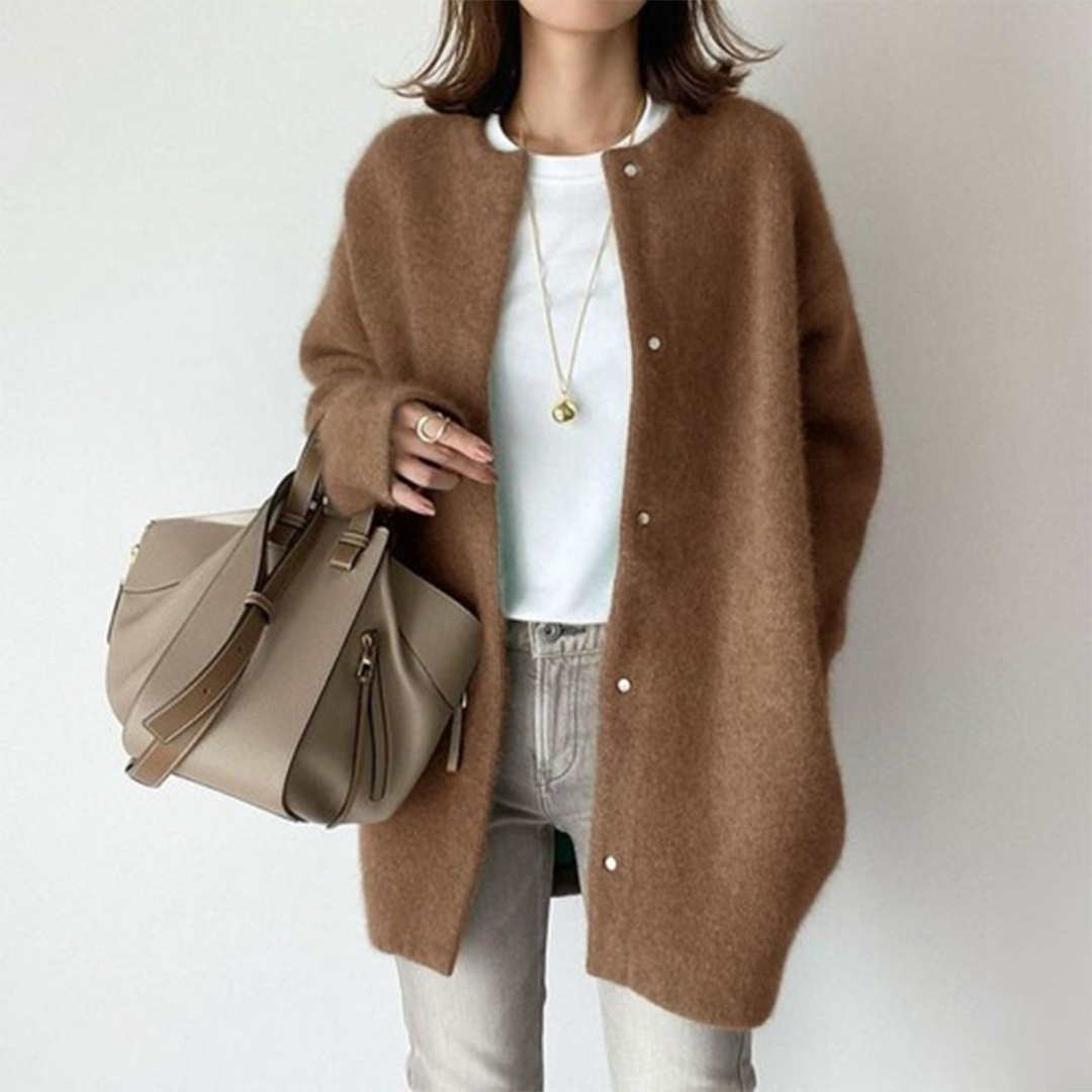 Model wears the same snap-button cardigan in warm brown, styled with a white tee and grey jeans 5