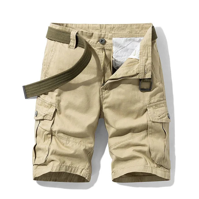 Front view of khaki cargo shorts with an olive green webbing belt, buttoned thigh pockets and a metal ring buckle. 3