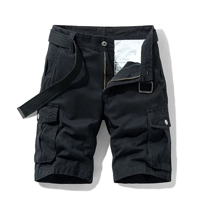 Front view of black cargo shorts with a black webbing belt, unzipped fly and large flap pockets on each thigh. 1