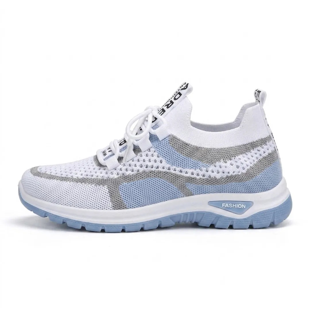 Side view of a white mesh trainer with pale blue panels, grey overlays, white laces and a pale blue sole. 1