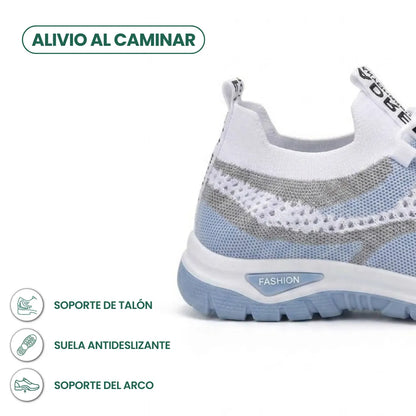 Close-up of the heel of the white and pale blue trainer, with callouts for heel support, non-slip sole and arch support. 4
