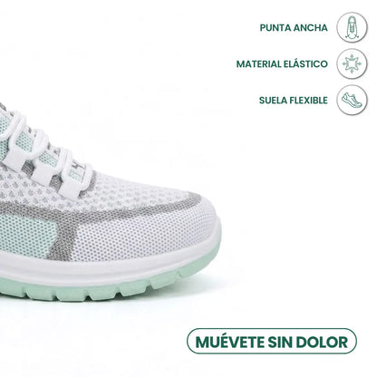 Close-up of the toe of the white and mint green trainer, with callouts for wide toe box, stretch material and flexible sole. 14