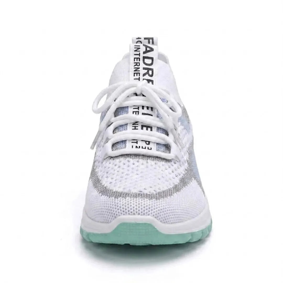 Front view of the white and mint green mesh trainer, showing the rounded toe, laces and printed heel tab. 17