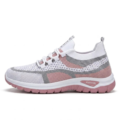 Side view of the white mesh trainer in a dusky pink colourway with grey overlays and a pink sole. 19