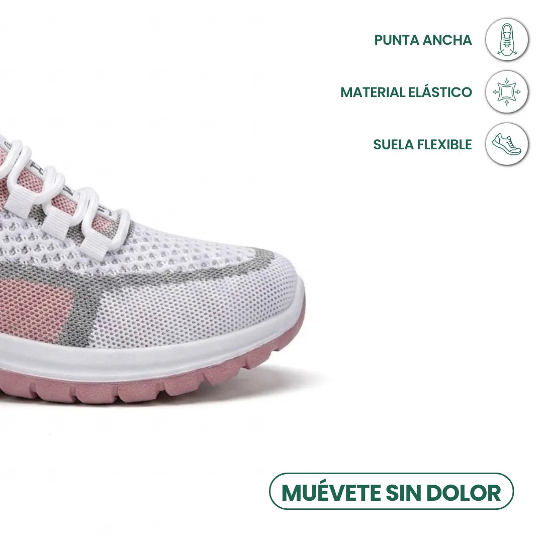 Close-up of the wide toe box of a white, grey and pink mesh trainer, with icons for stretch material and flexible sole. 23