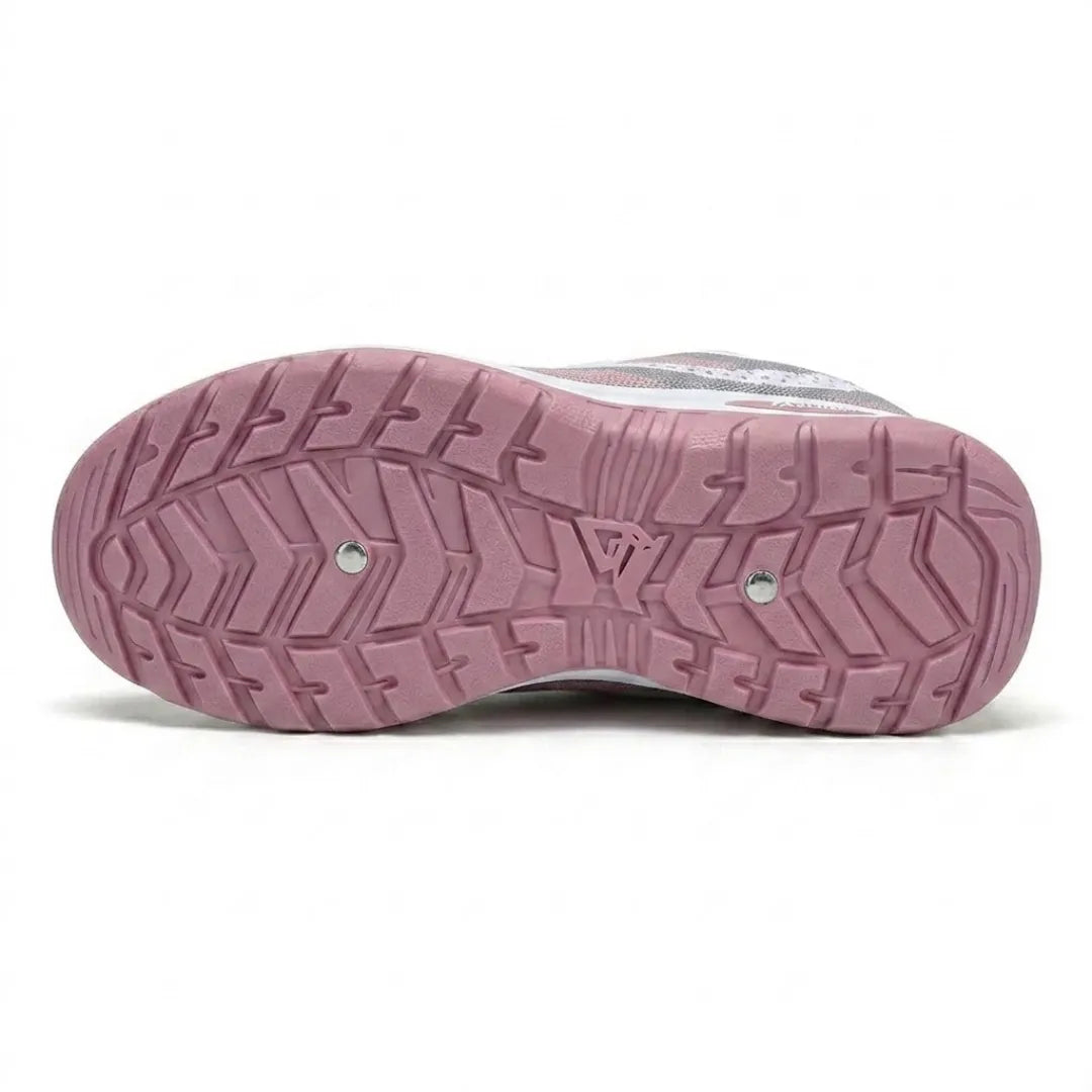 Underside of a pink trainer sole showing a deep chevron tread pattern for grip, with two small metal studs. 27