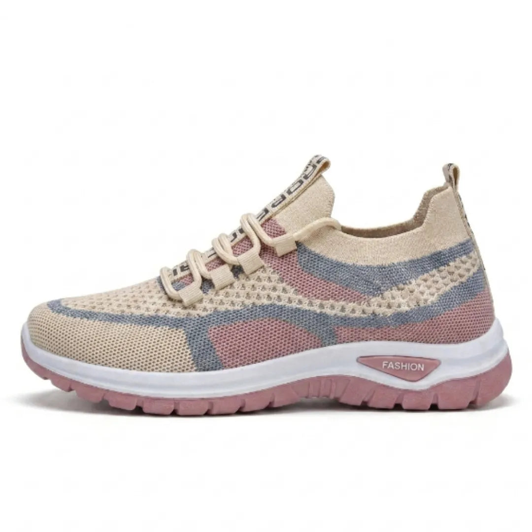 Side view of a beige, pink and grey knit mesh trainer with white midsole and pink outsole, laces fastened. 28