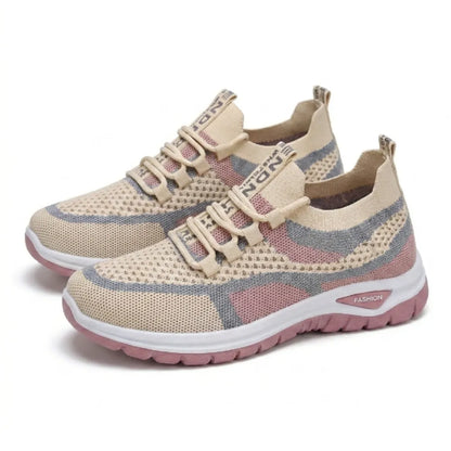 Pair of beige, pink and grey knit mesh trainers with white midsoles and pink outsoles, shown at an angle on a white background. 34