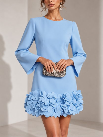 Pale blue version of the dress in a close front view, with flared sleeves and a hem of 3D petals. 5