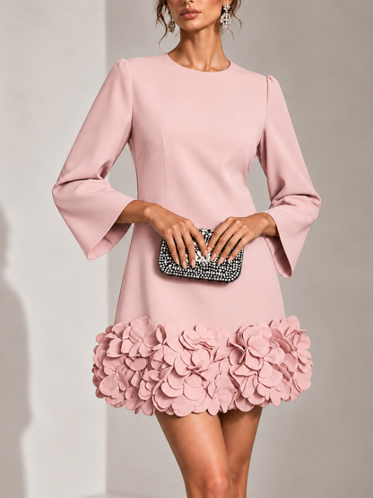 Dusty pink version of the dress in a close front view, with flared sleeves and a 3D petal hem. 9