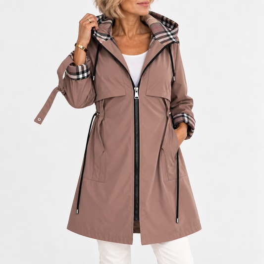 Model in a mocha-brown hooded zip coat with check lining, one hand in pocket, sleeve cuff turned up 1