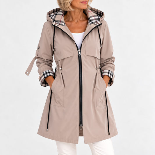 Model wearing the beige version from the front, hands in pockets, drawstring waist and check-lined hood visible 2
