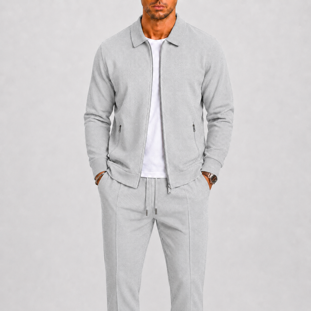 Model wearing the light grey waffle-textured zip jacket and matching trousers over a white t-shirt 4