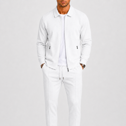 Model wearing the white waffle-textured zip jacket and matching trousers over a white t-shirt 2