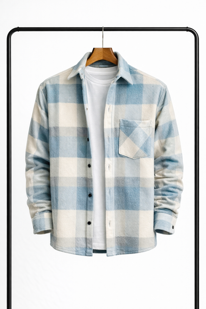 Front of the overshirt in pale blue and cream check, hanging open over a white tee, with a chest pocket. 1