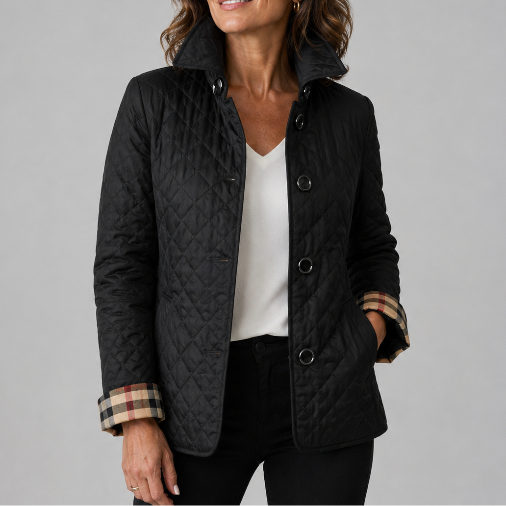 Black quilted jacket on a model, with a checked lining visible on the turned-back cuffs 3