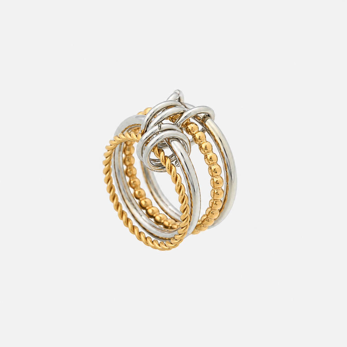 Same multi-band ring from a different angle, showing the twisted and beaded gold-tone bands and the silver-tone loops that link them. 2