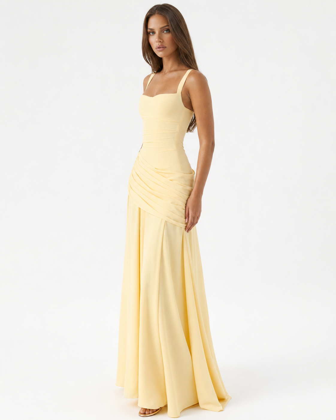 Pale yellow dress worn at a three-quarter angle, showing the draped ruched hip panel and sweeping skirt 2