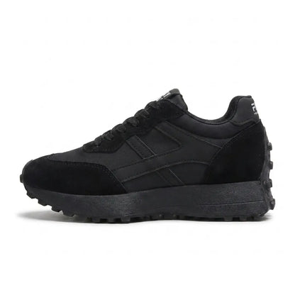 Side view of an all-black suede and nylon platform trainer with chunky treaded sole 6