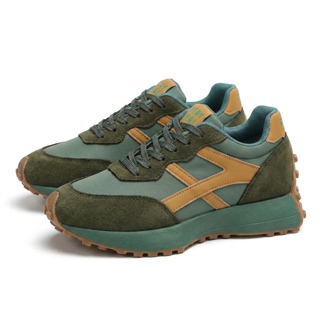Pair of green trainers with tan stripes and gum soles, shown at an angle 13