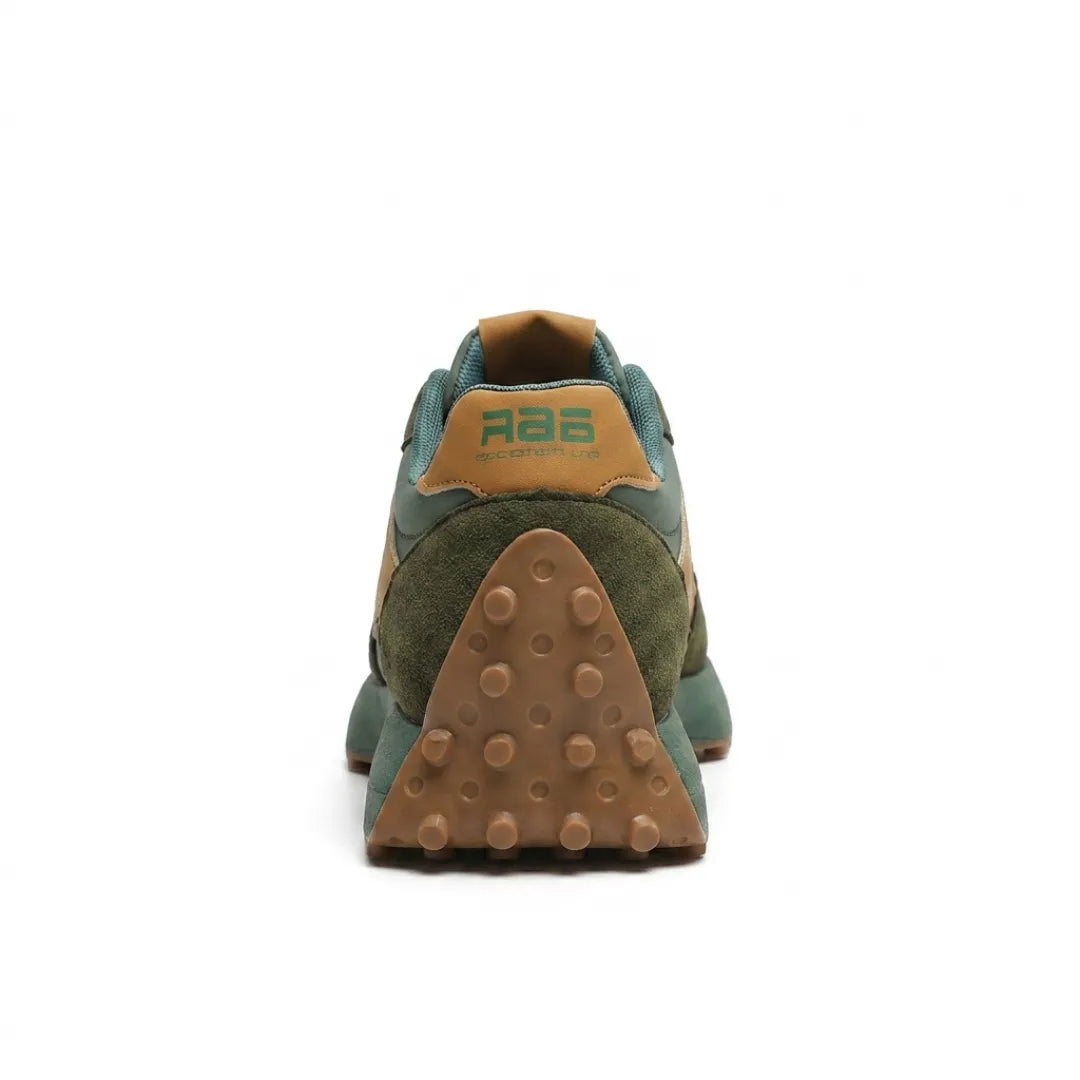Rear view of the green trainer showing tan heel tab and studded gum heel sole 15