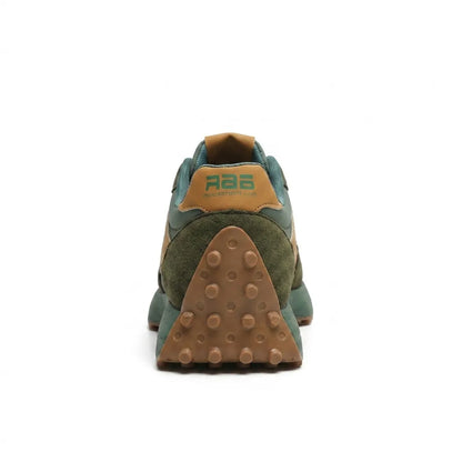 Rear view of the green trainer showing tan heel tab and studded gum heel sole 15