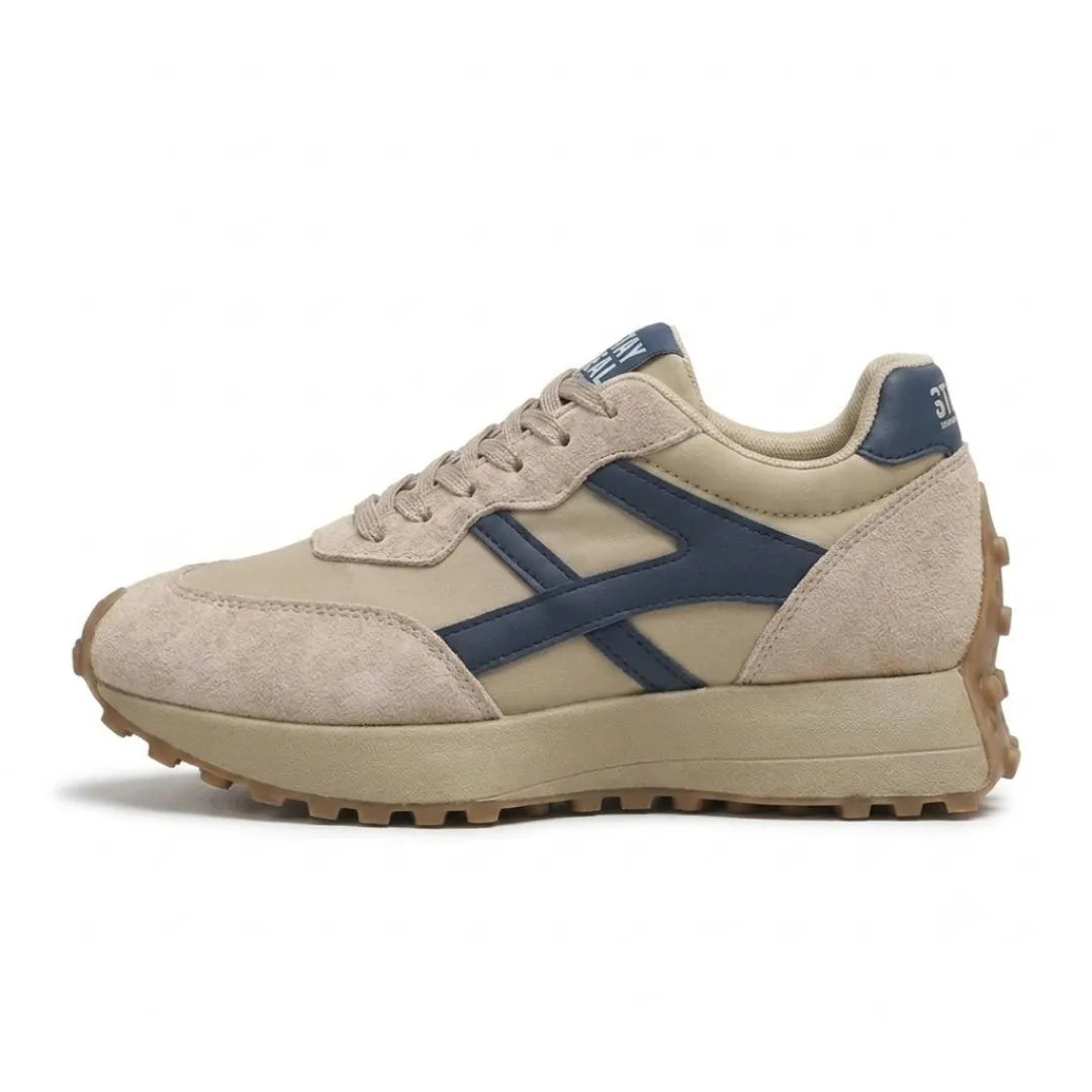 Side view of a beige suede and nylon platform trainer with navy side stripes and gum sole 1