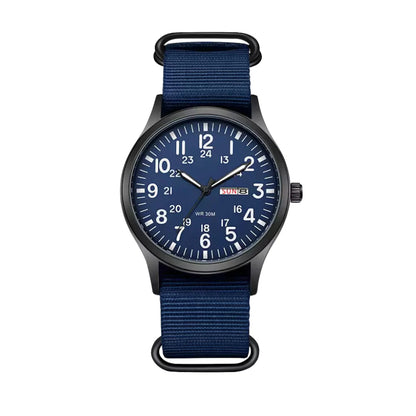 Front view of the version with a navy blue dial, white numerals, day-date window and matching navy woven strap. 6