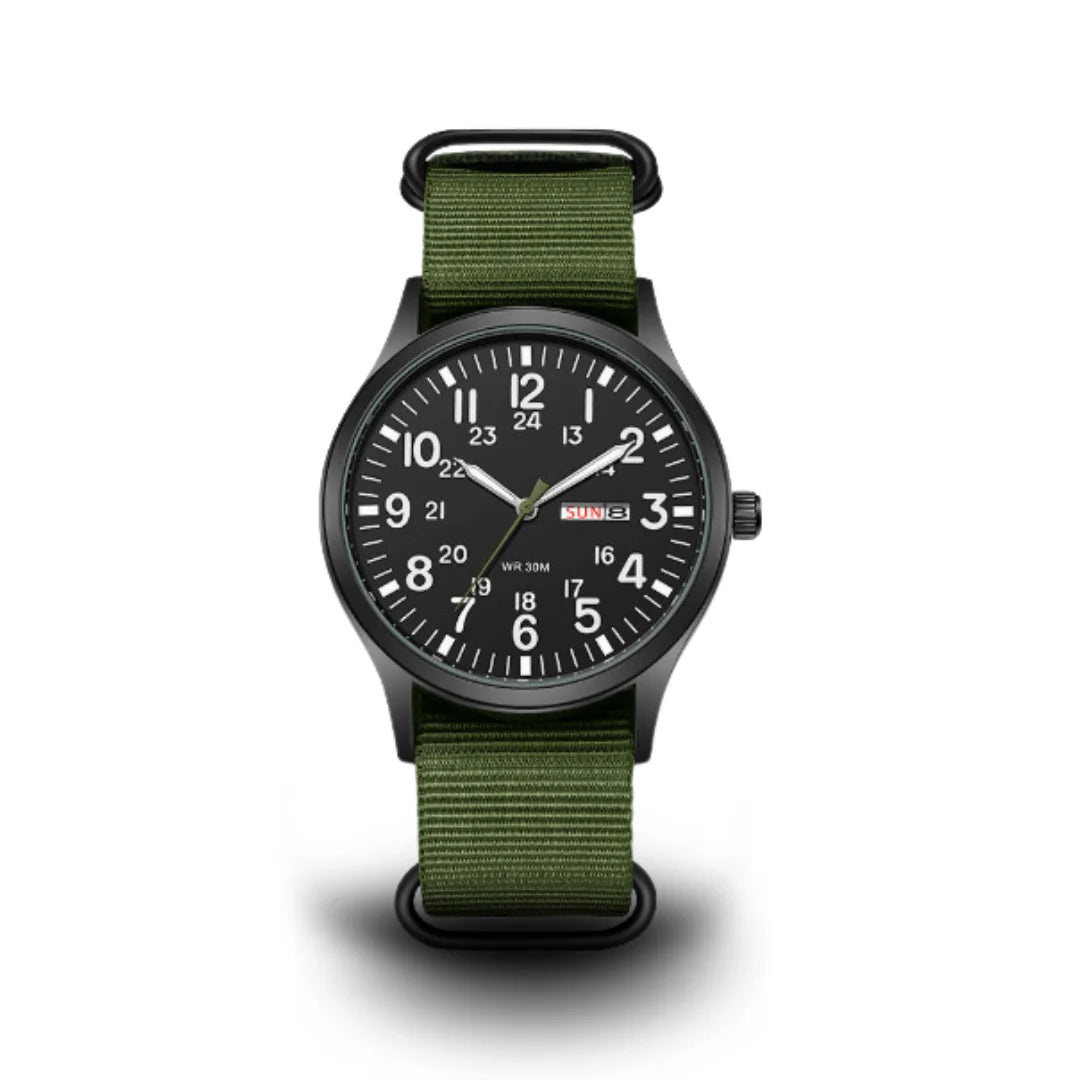 Front view on a white background of the watch with black dial, white numerals, day-date window and olive green woven strap. 1