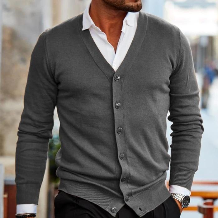 Model wearing the cardigan in charcoal grey with a white shirt and black trousers 4