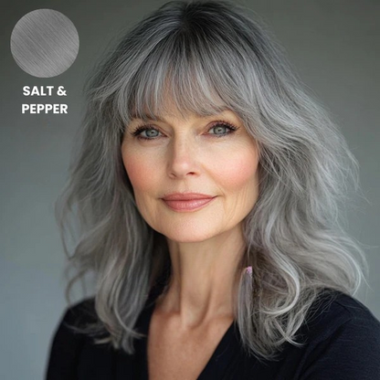 Older model with wavy salt and pepper grey hair and a fringe, with swatch 9
