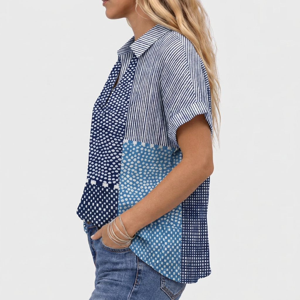 Side view of the shirt on a model, showing the rolled sleeve cuff and striped panel 3