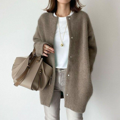 Model wears the same snap-button cardigan in muted taupe, styled with a white tee and grey jeans 7