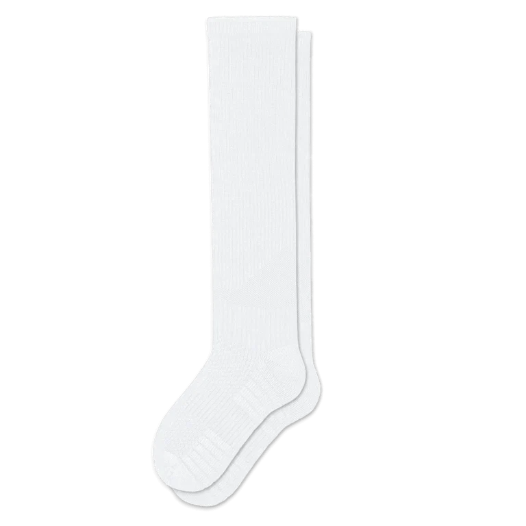 Pair of white knee-high ribbed socks laid flat on a white background, with a cushioned patterned foot section. 4