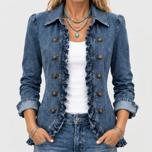 Close-up of the blue denim jacket's ruffled front edge and bronze buttons, worn over a white top 1