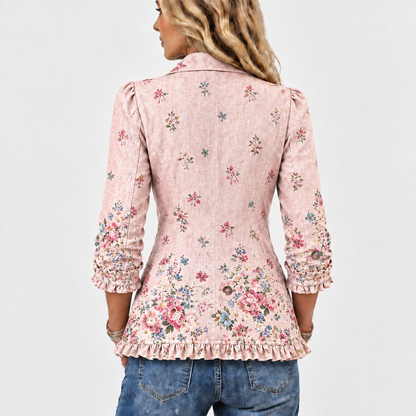 Back view of the pink floral jacket showing scattered flowers, ruffled hem and gathered three-quarter sleeves 5