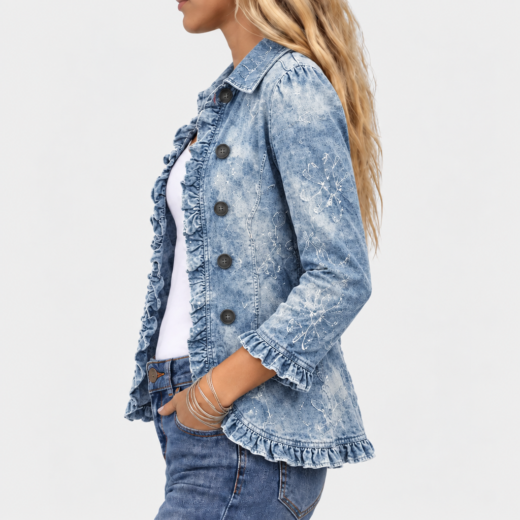 Side view of the denim jacket showing the ruffled front edge, ruffled cuff and hem, and white botanical sleeve pattern 3