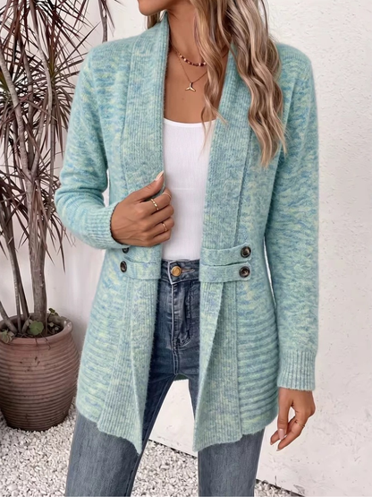 Light blue-green marl version of the cardigan, worn open with one hand at the lapel 3