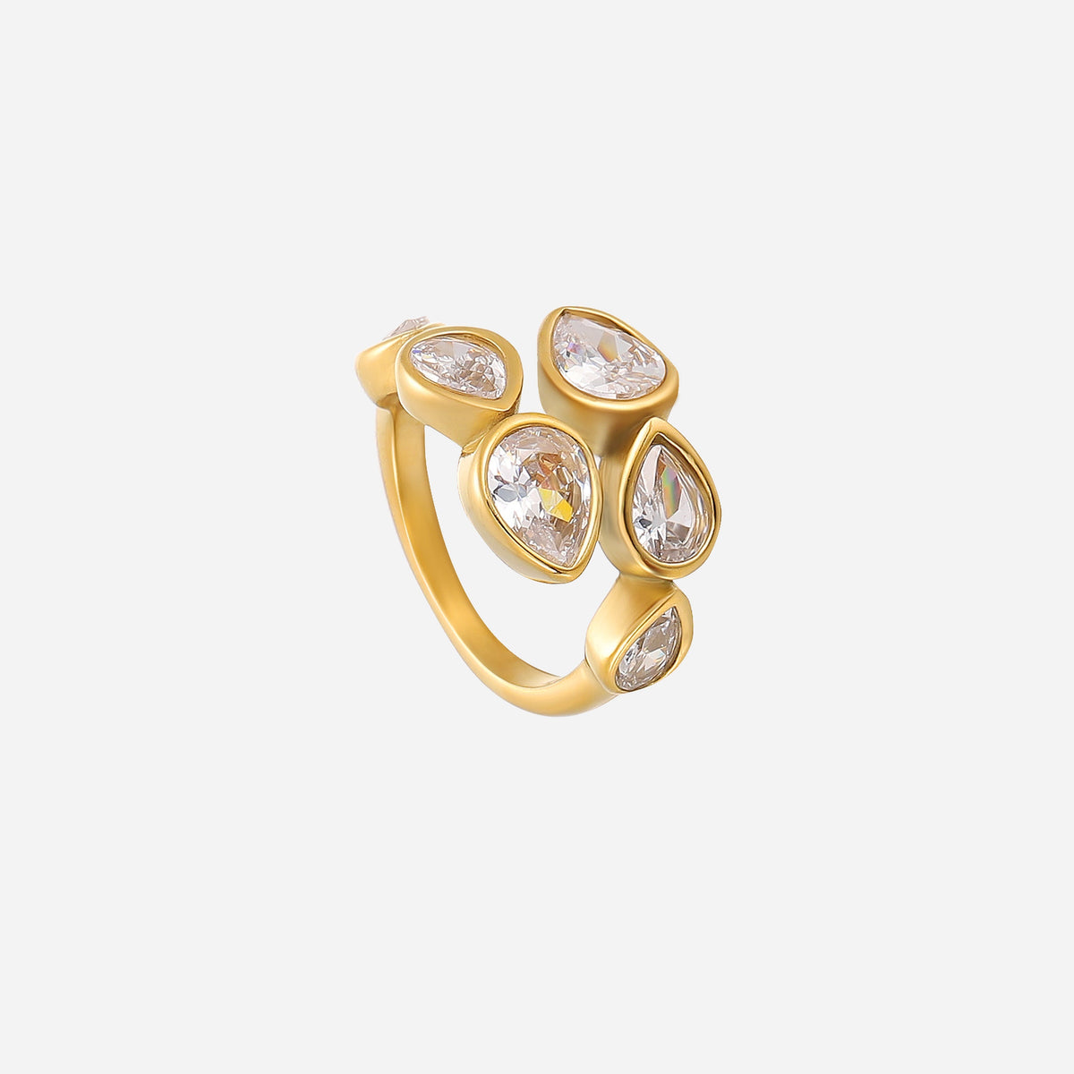 Same gold-toned ring from a different angle, showing the cluster of clear teardrop crystals and the slim open band against a plain background. 2