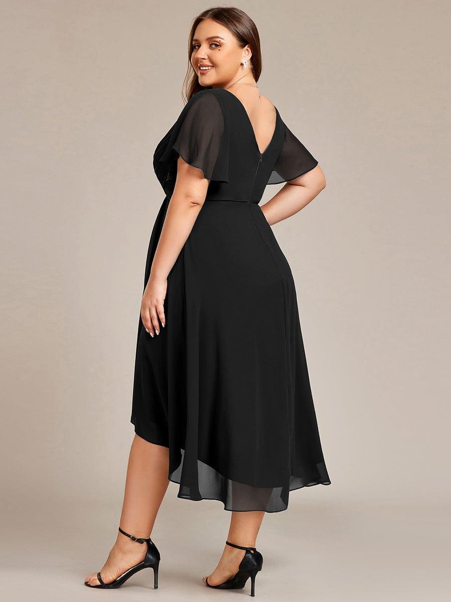 Plus-size model in the black dress seen from behind, showing the V back, zip and sheer flutter sleeves. 27