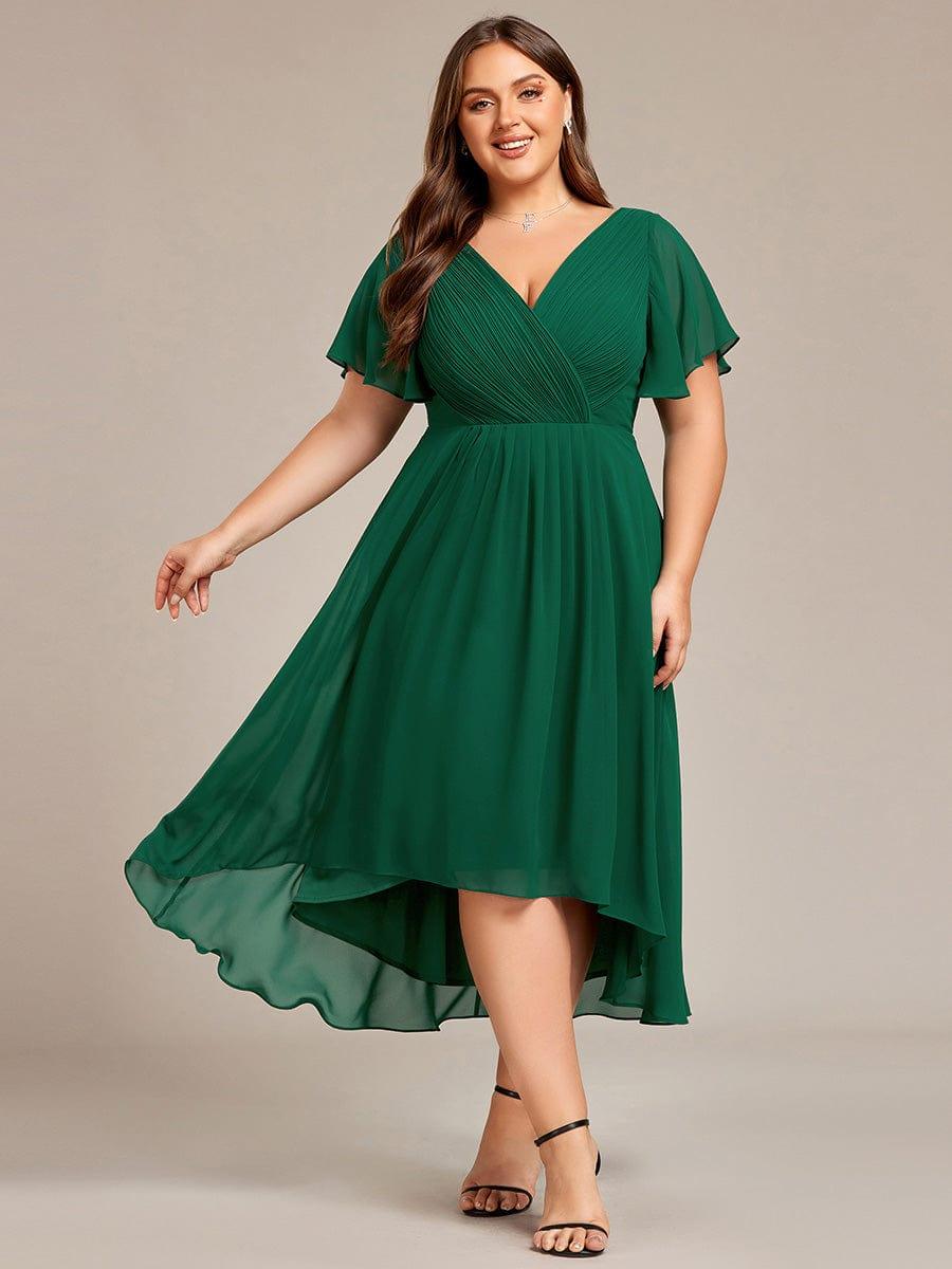 Plus-size model wearing the dress in deep green, skirt swinging out to show the high-low hem. 36