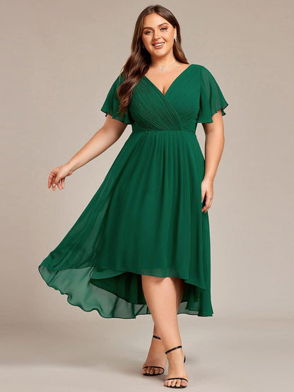 Plus-size model wearing the dress in deep green, skirt swinging out to show the high-low hem. 36