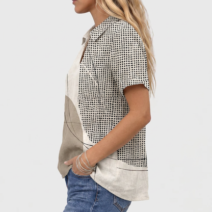 Side view of the short-sleeved shirt, showing the dotted sleeve and curved hem 4