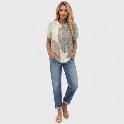 Full-length view of the shirt worn untucked with rolled-up jeans and tan sandals 3