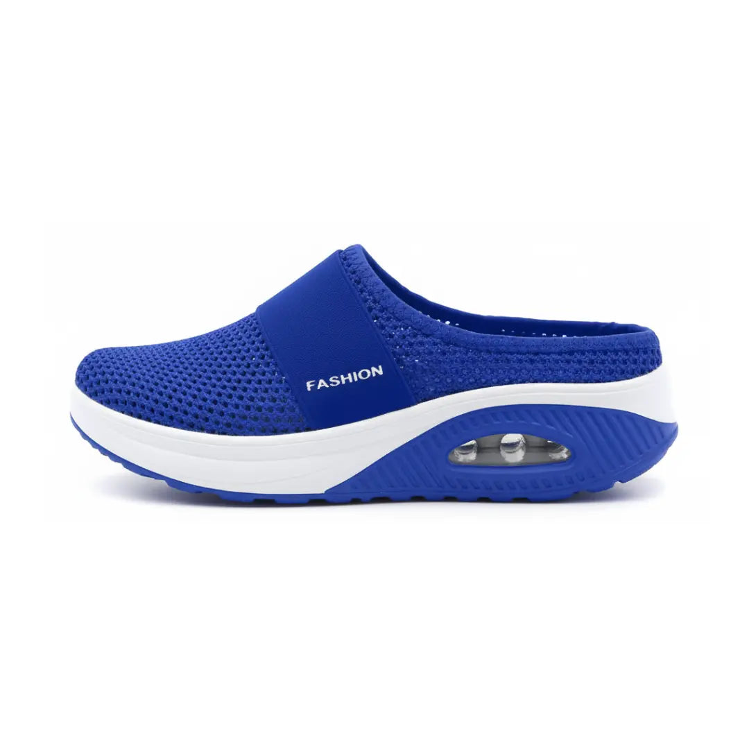 Side view of a single royal blue mesh mule with elastic strap, white midsole and air cushion heel. 11